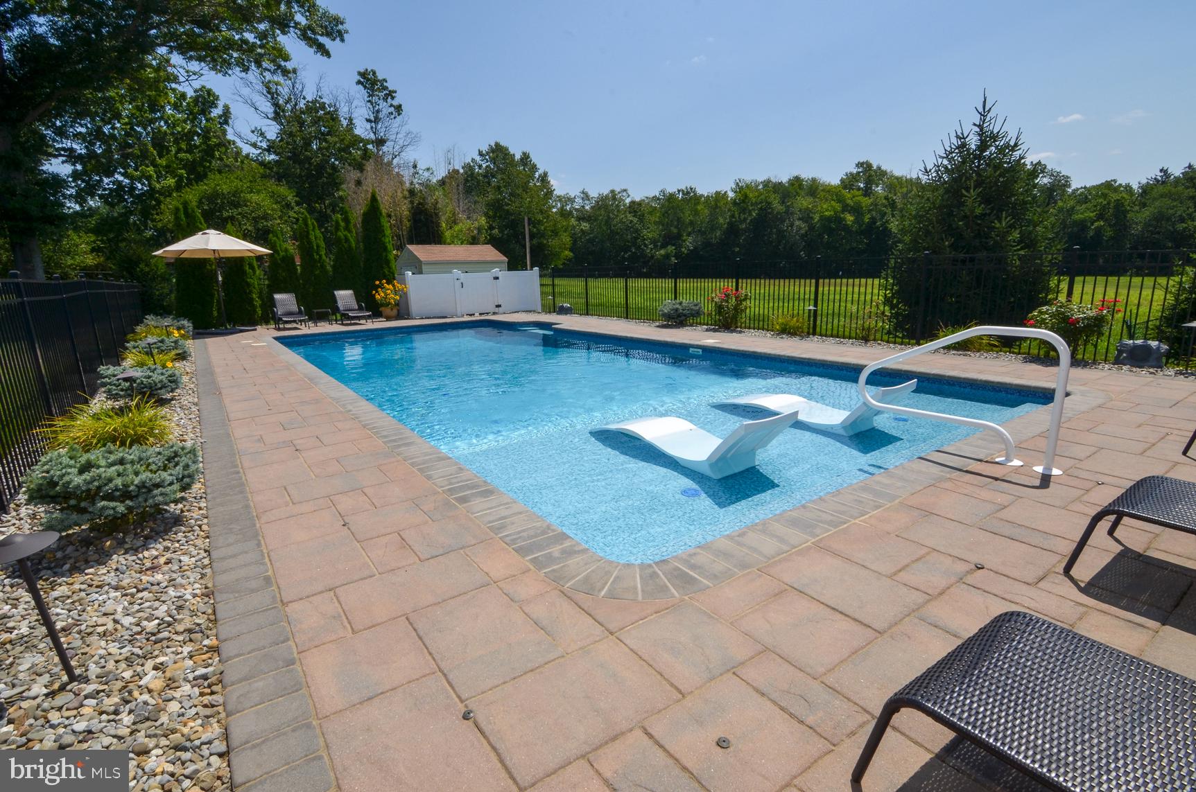 3 Aqua Terrace Hamilton, NJ 08620 - Photo 35 of 39 a view of a swimming pool with a lounge chair and tables