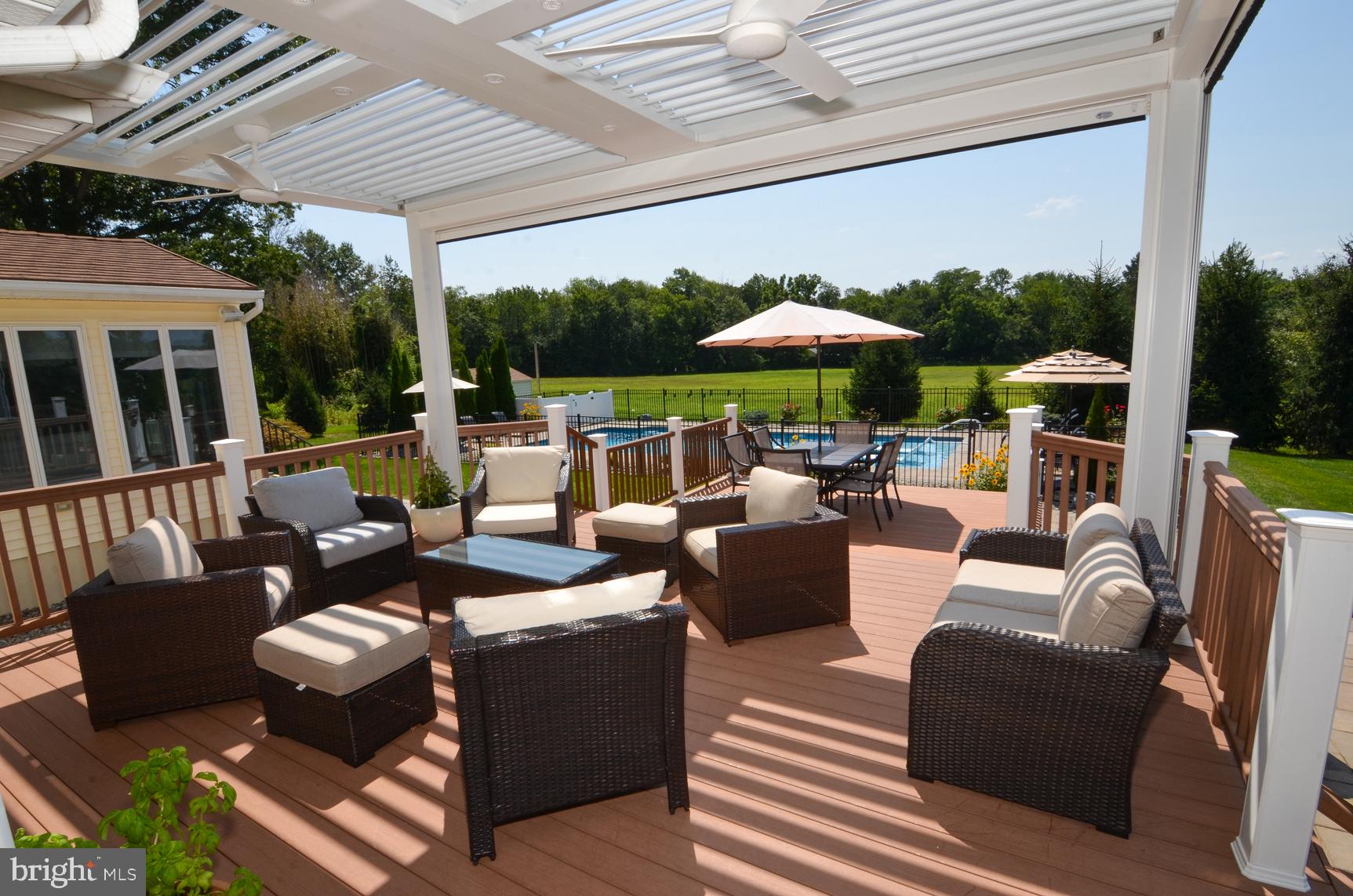 3 Aqua Terrace Hamilton, NJ 08620 - Photo 7 of 39 a view of a patio with couches chairs dining table and chairs barbeque grill with a small yard and large trees