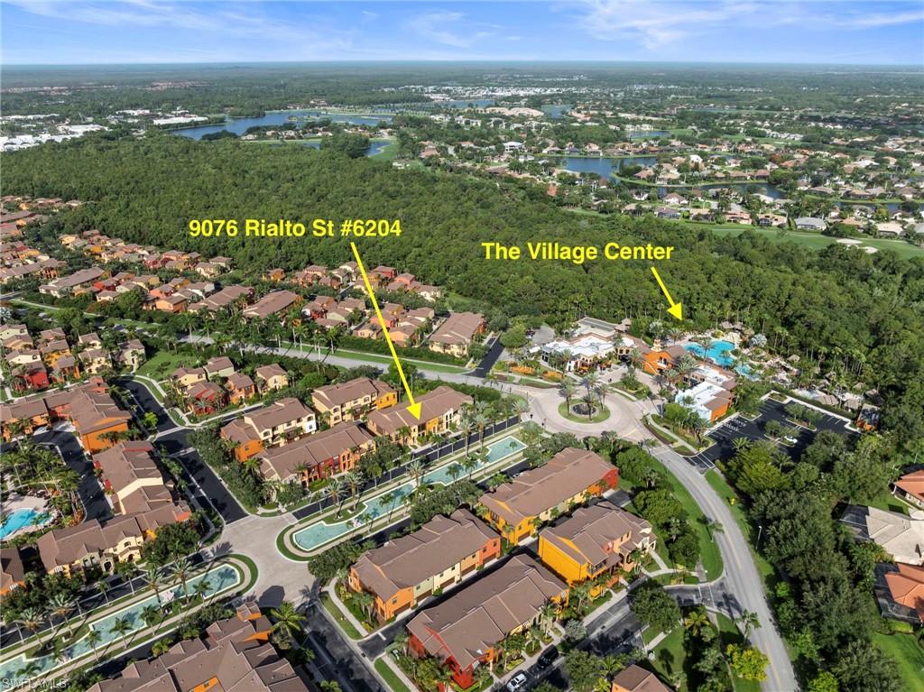 9076 Rialto Street, Unit 6204 Naples, FL 34113 - Photo 35 of 50 Aerial perspective showcasing a residential community with Mediterranean-inspired architecture and surrounding green spaces