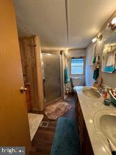 2298 Youngblood Road Great Cacapon, WV 25422 - Photo 3 of 11 a bathroom with a tub and shower