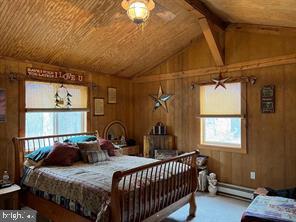 2298 Youngblood Road Great Cacapon, WV 25422 - Photo 4 of 11 a bedroom with bed and a window