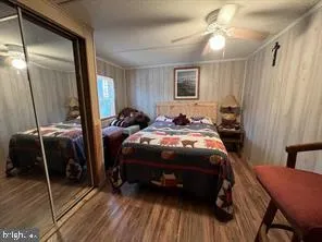 a bedroom with a bed and a mirror