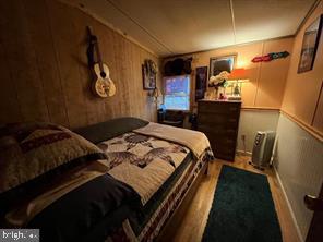 2298 Youngblood Road Great Cacapon, WV 25422 - Photo 6 of 11 a bedroom with a bed and a mirror