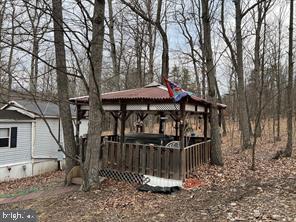 2298 Youngblood Road Great Cacapon, WV 25422 - Photo 7 of 11 a view of a house with a yard