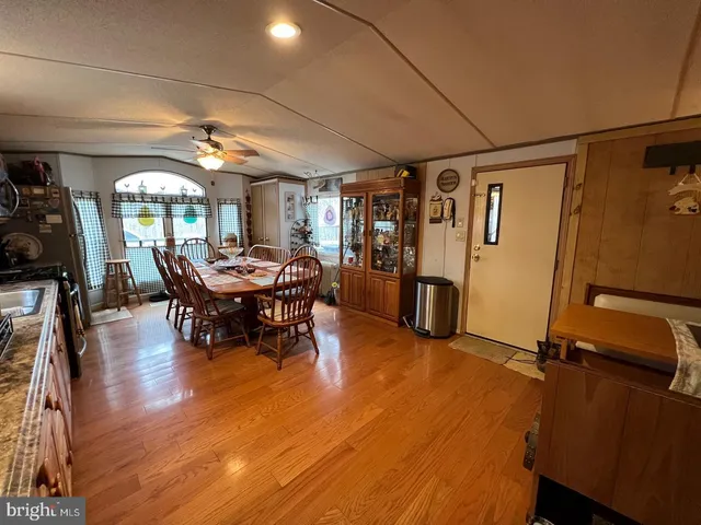 a view of a livingroom with furniture and a window
