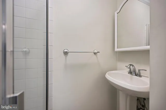 a bathroom with a sink and mirror
