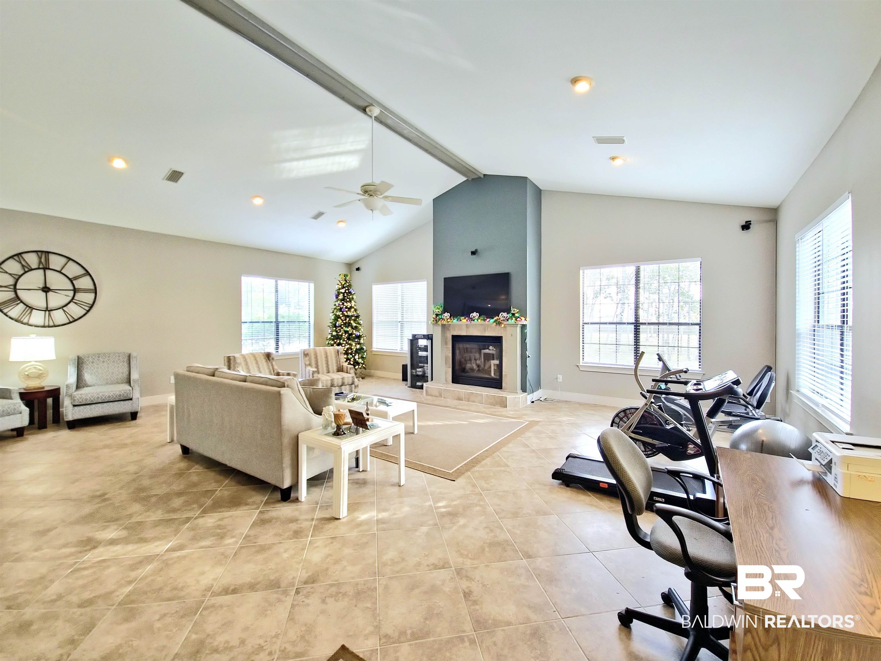 4650 Griffith Marina Road, Unit 12 Orange Beach, AL 36561 - Photo 24 of 34 Living room featuring a tiled fireplace and light tile patterned flooring