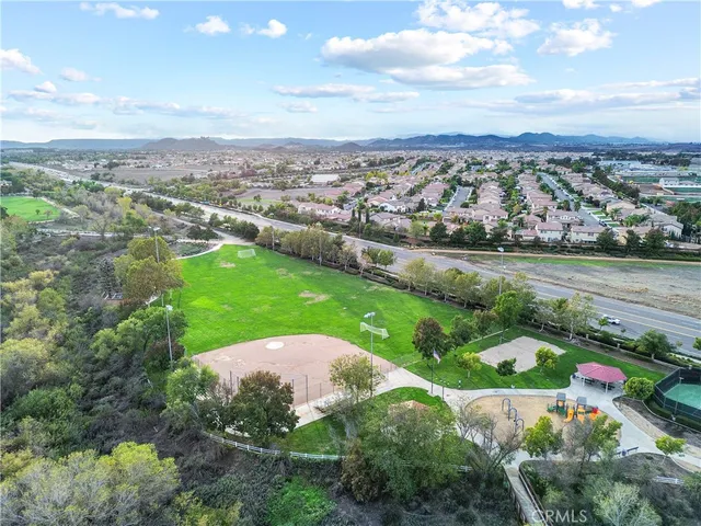 an aerial view of a house with yard swimming pool and outdoor seating