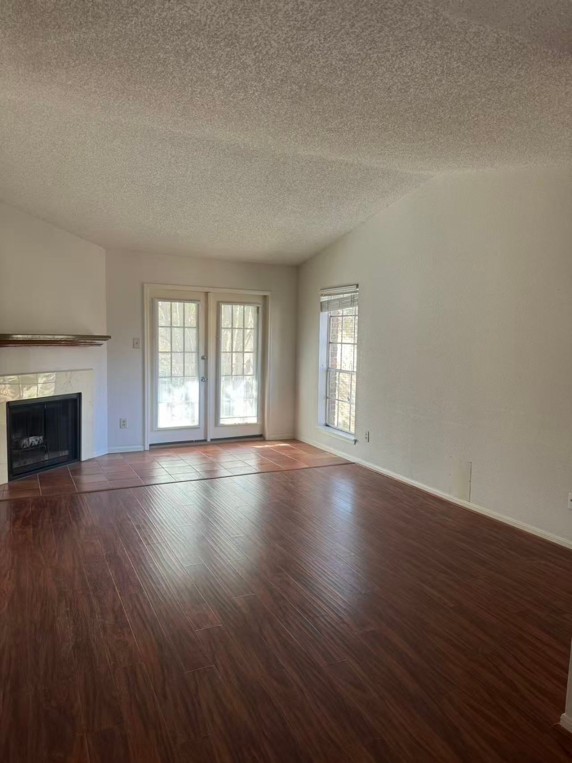 1515 Sandy Springs Road, Unit 2002 Houston, TX 77042 - Photo 18 of 19 an empty room with wooden floor and windows