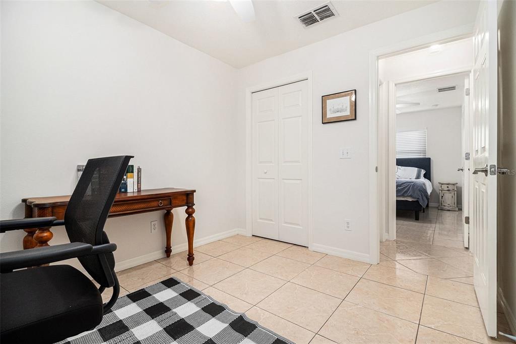 237 California Avenue St. Cloud, FL 34769 - Photo 16 of 26 a view of a workspace with furniture and gym equipment