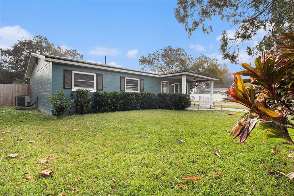 237 California Avenue St. Cloud, FL 34769 - Photo 19 of 26 a view of a house with garden and trees