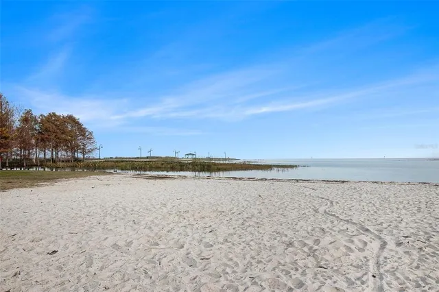 a view of an ocean beach and mountain