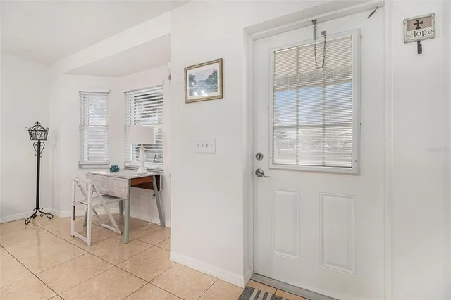 a dining room with furniture and windows