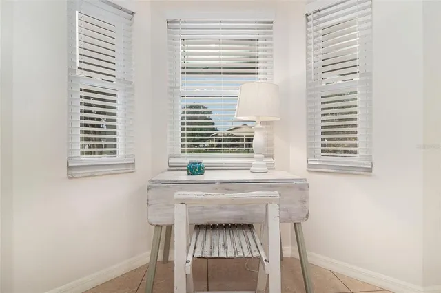 a kitchen with a window and cabinets