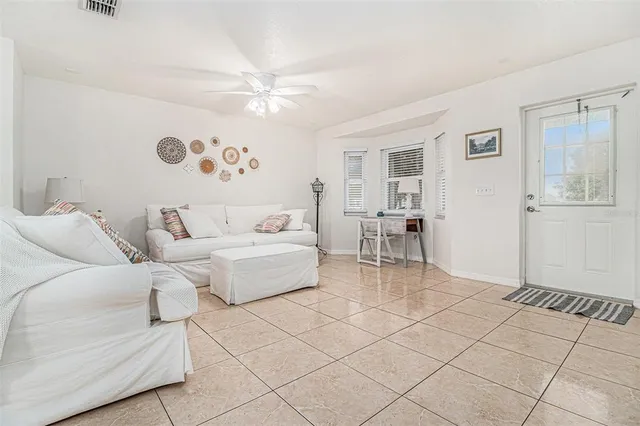a living room with furniture and a table