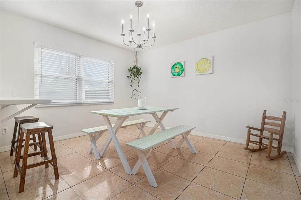 237 California Avenue St. Cloud, FL 34769 - Photo 8 of 26 a view of a dining room with furniture and window