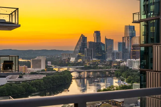 a view of a lake with a large building