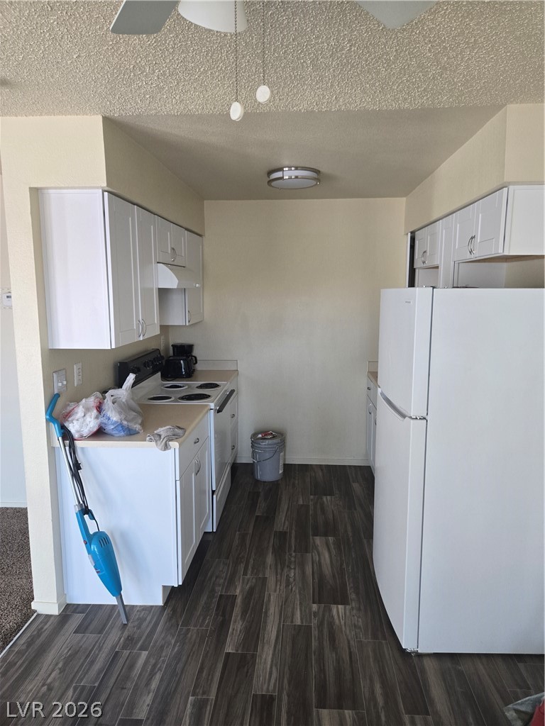 1388 East Desert Inn Road, Unit 2 Las Vegas, NV 89169 - Photo 5 of 23 Functional utility space with durable tile flooring and essential laundry appliances.