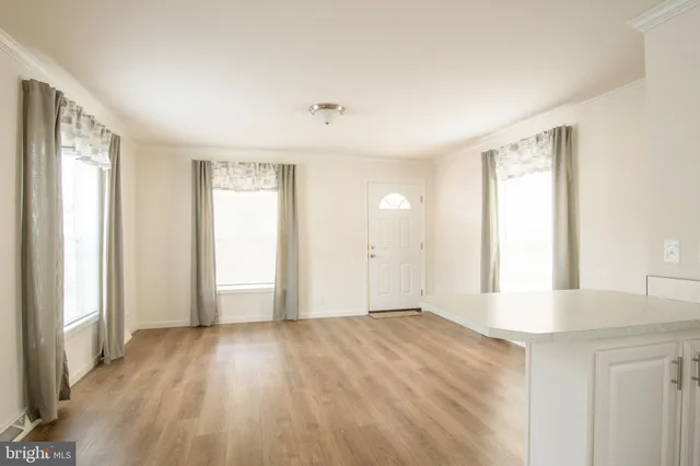 a view of an empty room and window