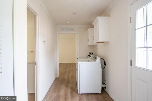 a view of a storage & utility room with a window