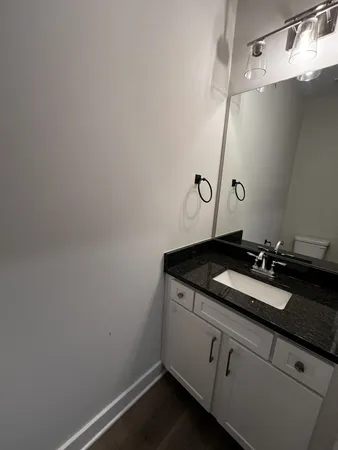 a bathroom with a sink and vanity