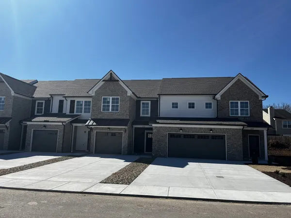 a kitchen with stainless steel appliances kitchen island granite countertop a refrigerator stove and oven