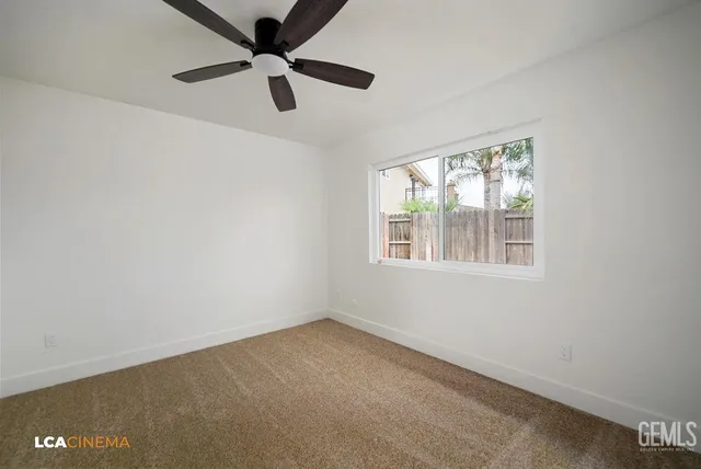 a bedroom with a bed potted plant and a window