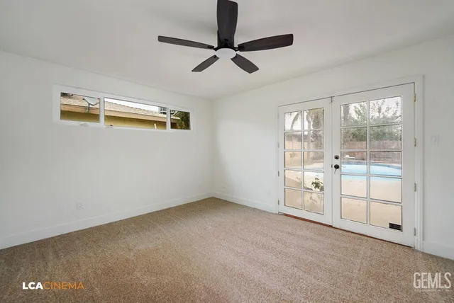 a bedroom with a bed a couch and a window