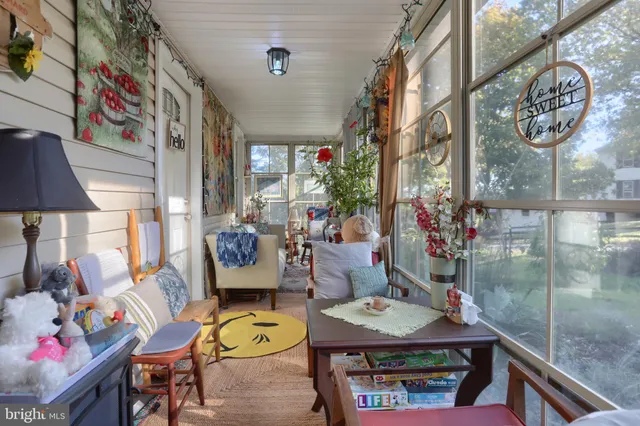 a dining room with furniture and a chandelier
