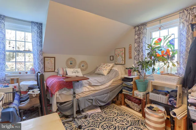 a bed room with furniture and a window