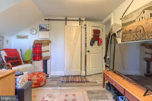 a bedroom with a bed and a couch