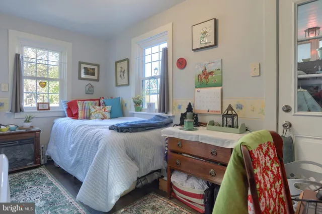 a bedroom with a bed and a table in it