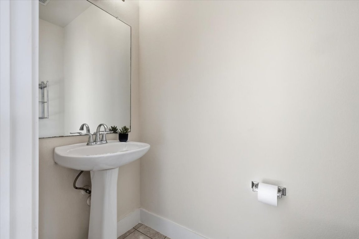 13420 Lyndhurst Street, Unit 807 Austin, TX 78717 - Photo 14 of 33 a bathroom with a sink a mirror and a window