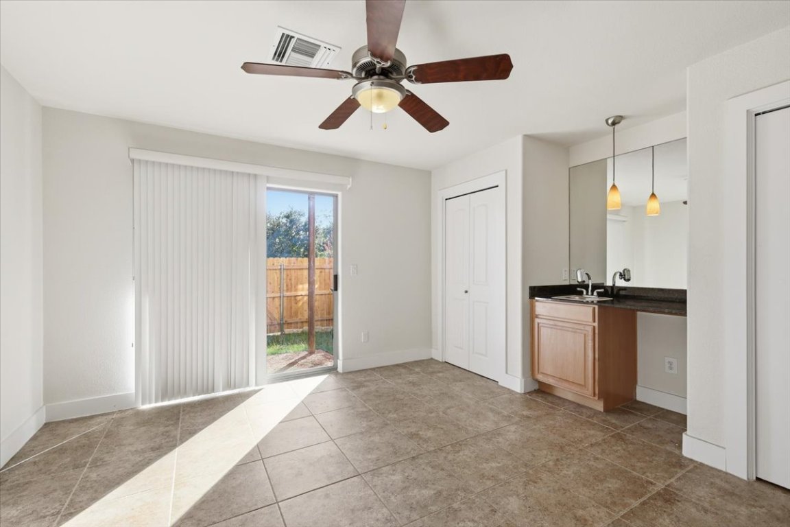 13420 Lyndhurst Street, Unit 807 Austin, TX 78717 - Photo 25 of 33 a view of an empty room with a ceiling fan