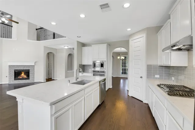 a view of kitchen with furniture and wooden floor