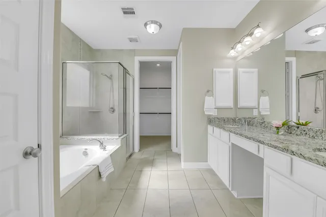 a bathroom with a granite countertop sink mirror and a