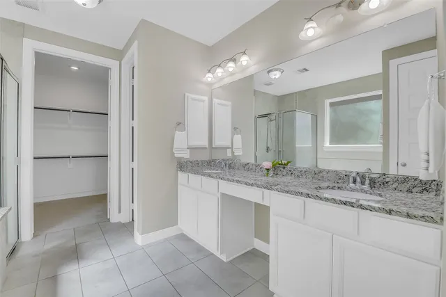 a bath tub sitting next to a shower