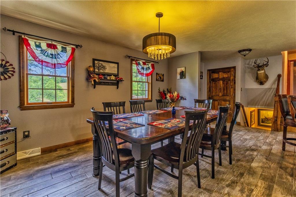 270 Old Post Road Prosperity, PA 15329 - Photo 23 of 43 a view of a dining room with furniture window and wooden floor