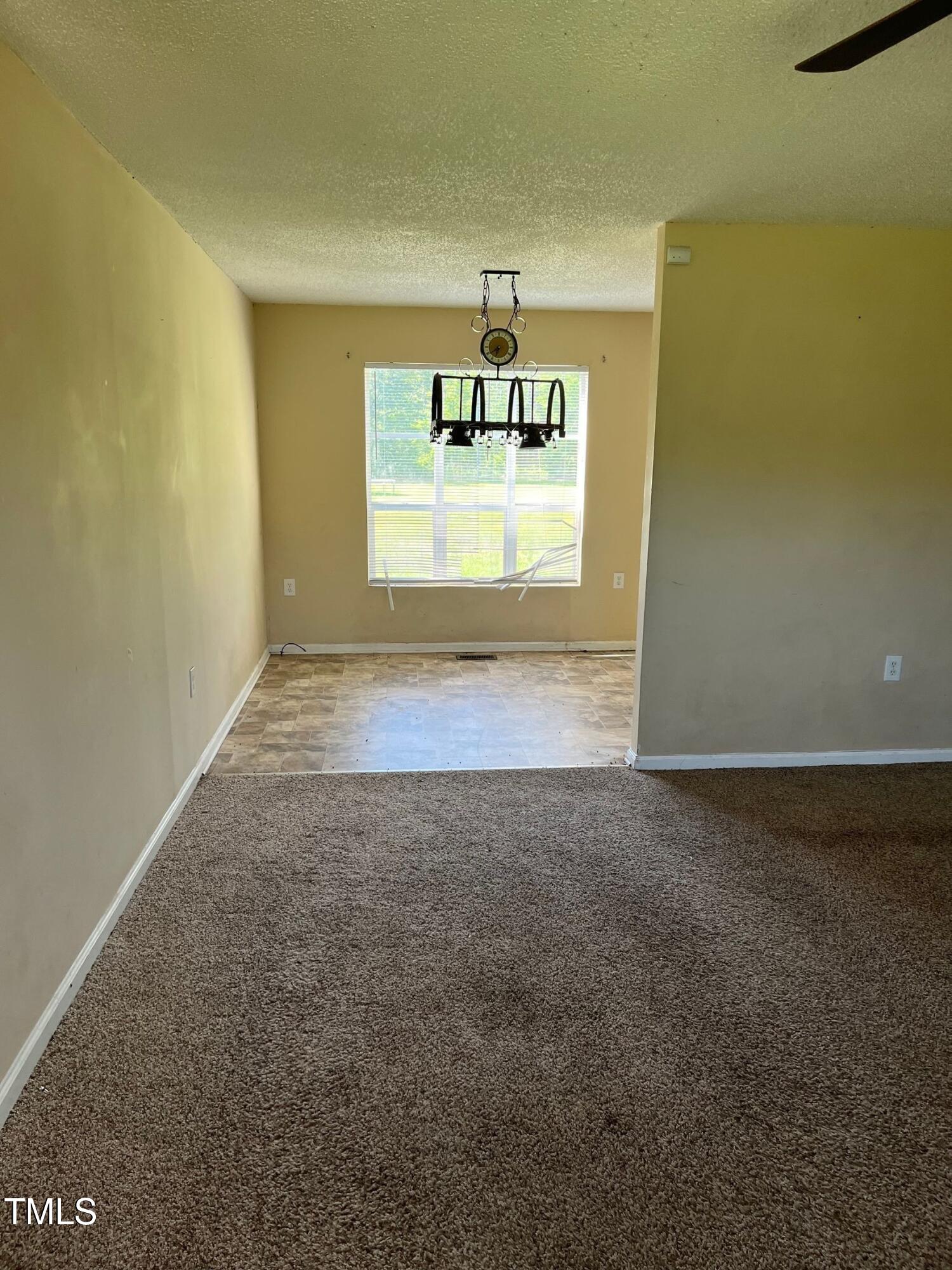 6951 Johnson Road Fayetteville, NC 28312 - Photo 2 of 6 a view of an empty room and window