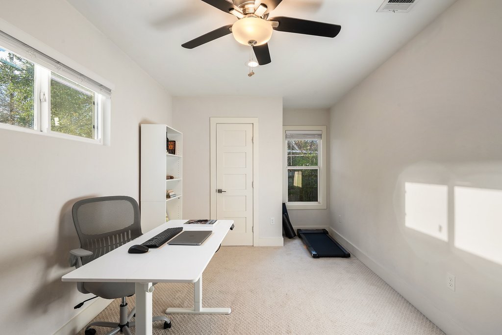 2702 Crest Avenue, Unit 1 Austin, TX 78702 - Photo 29 of 29 Bright and airy, this bedroom adds flexibility to the home's floor plan.
