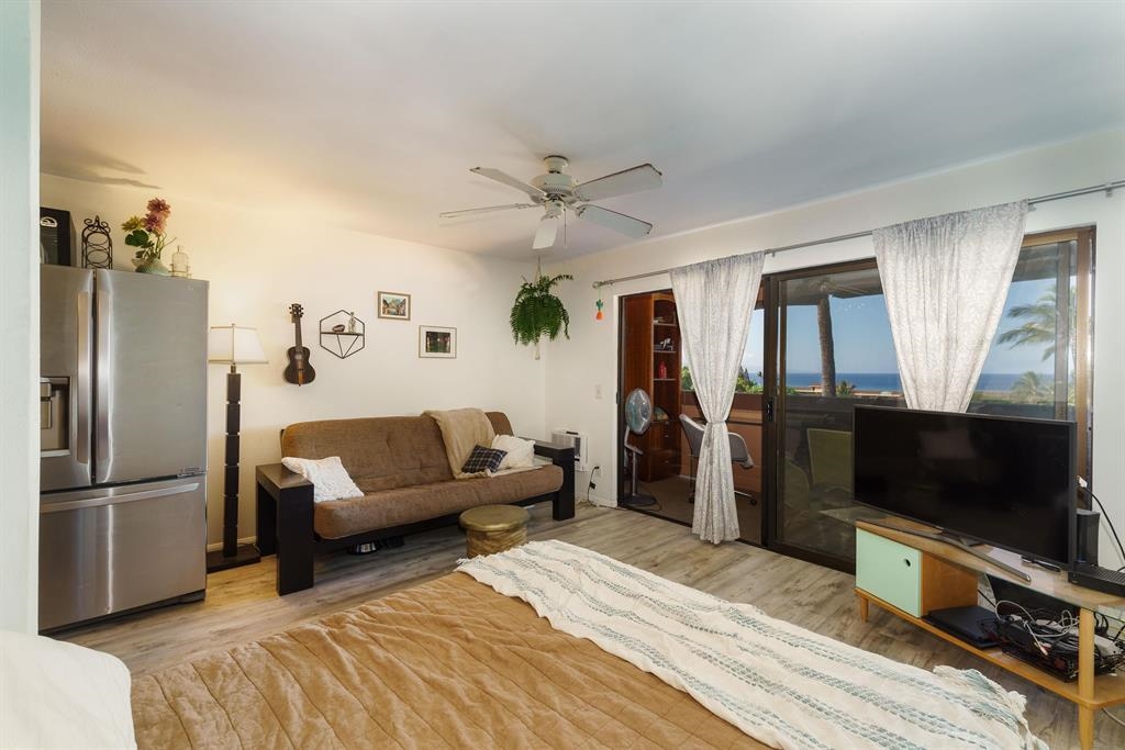 3740 Lower Honoapiilani Road, Unit G309 Lahaina, HI 96761 - Photo 5 of 17 a living room with furniture and a flat screen tv