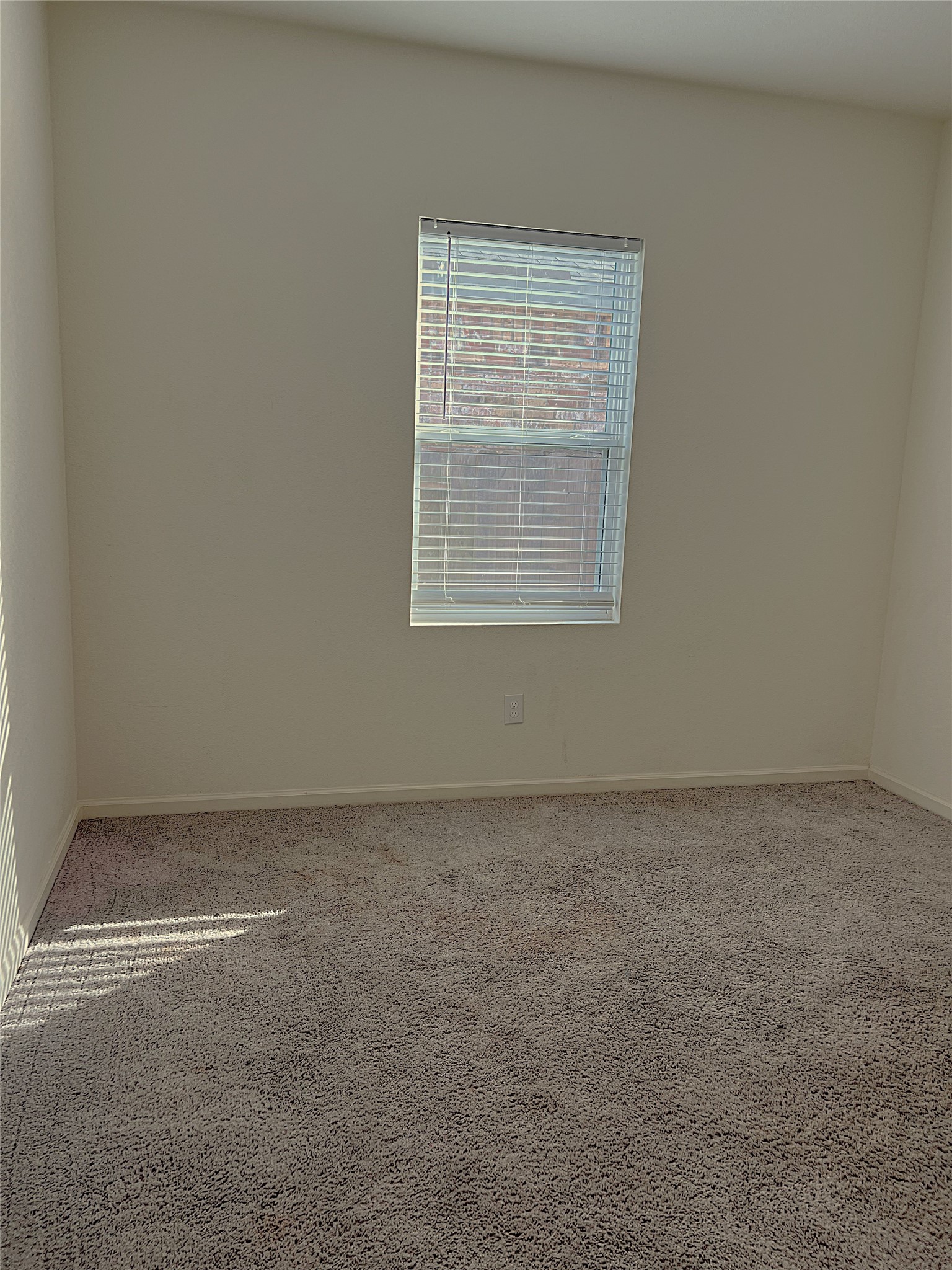 14715 Peaceful Way New Caney, TX 77357 - Photo 11 of 33 a view of an empty room with a window