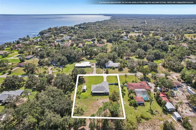 an aerial view of house with yard