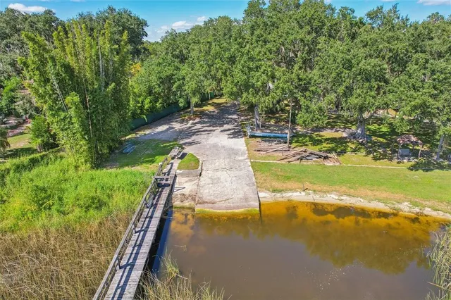 a view of a swimming pool with an outdoor space and seating area