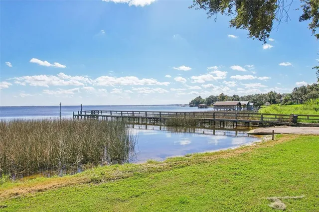 a view of a lake with a yard
