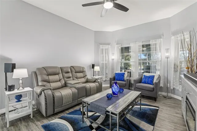 a living room with furniture and a rug