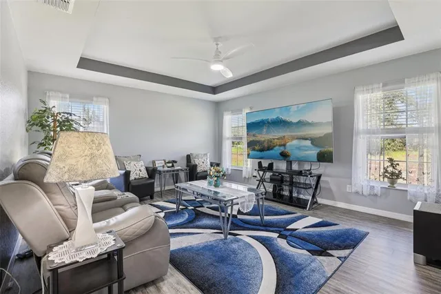 a living room with furniture and a large window