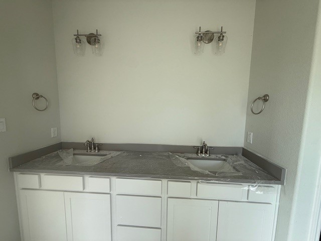 6422 Raleigh Loop College Station, TX 77845 - Photo 11 of 21 a sink sitting next to a bathroom