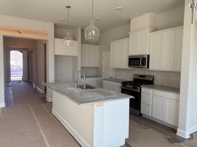 6422 Raleigh Loop College Station, TX 77845 - Photo 15 of 21 a kitchen with a sink stove and microwave