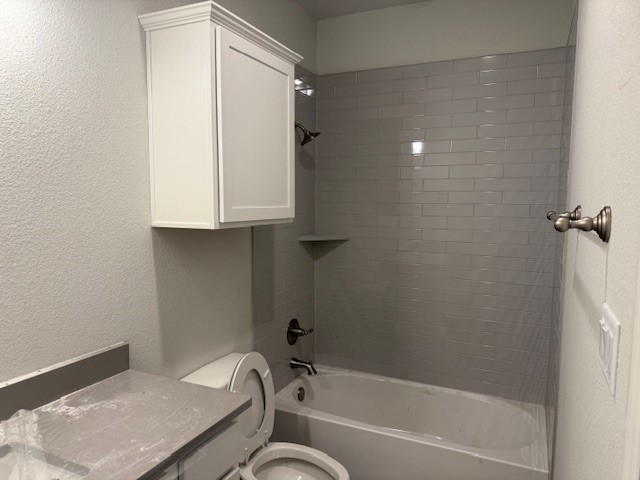 6422 Raleigh Loop College Station, TX 77845 - Photo 3 of 21 a bathroom with a granite countertop sink toilet and bathtub